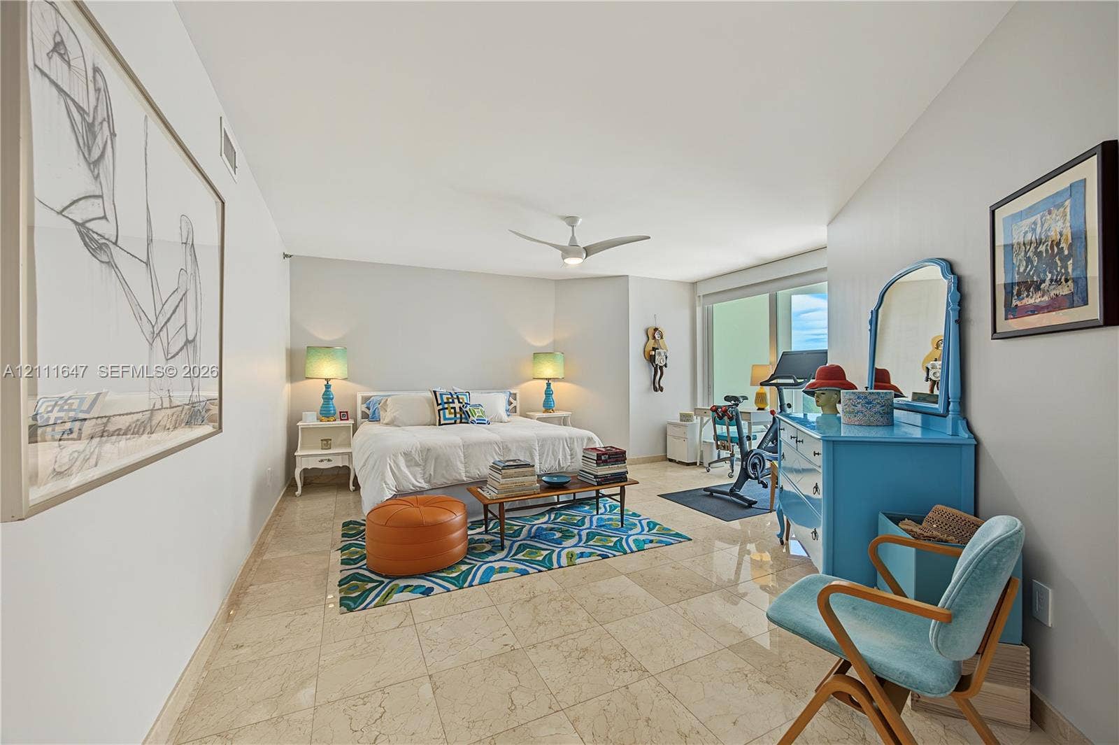 8925 Collins Avenue, #4J, Surfside, FL 33154 Large-format tile flooring, multi-blade ceiling fan, and floor-to-ceiling glass panel windows