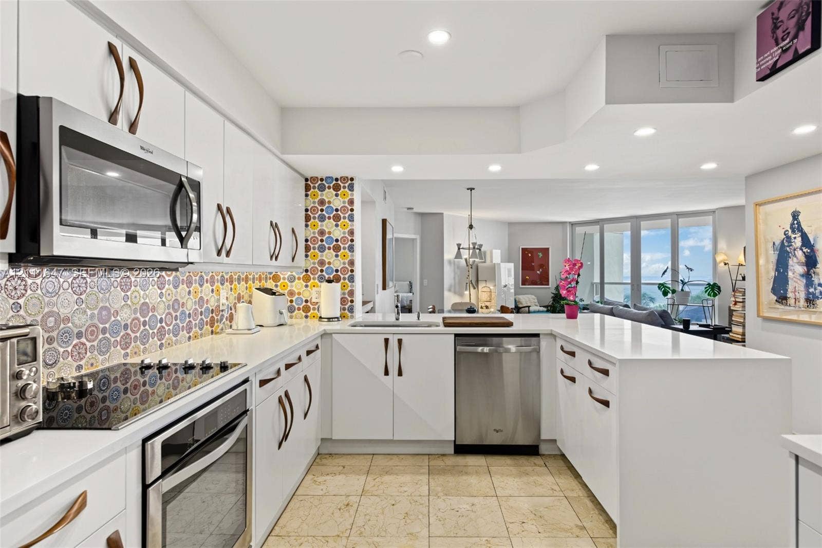 8925 Collins Avenue, #4J, Surfside, FL 33154 Kitchen featuring white cabinetry, quartz countertops, patterned tile backsplash, stainless steel appliances, and recessed lighting