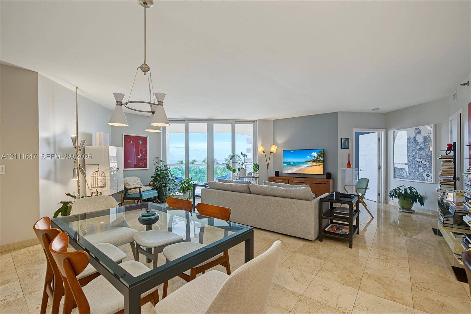 8925 Collins Avenue, #4J, Surfside, FL 33154 Open-concept living area featuring floor-to-ceiling windows