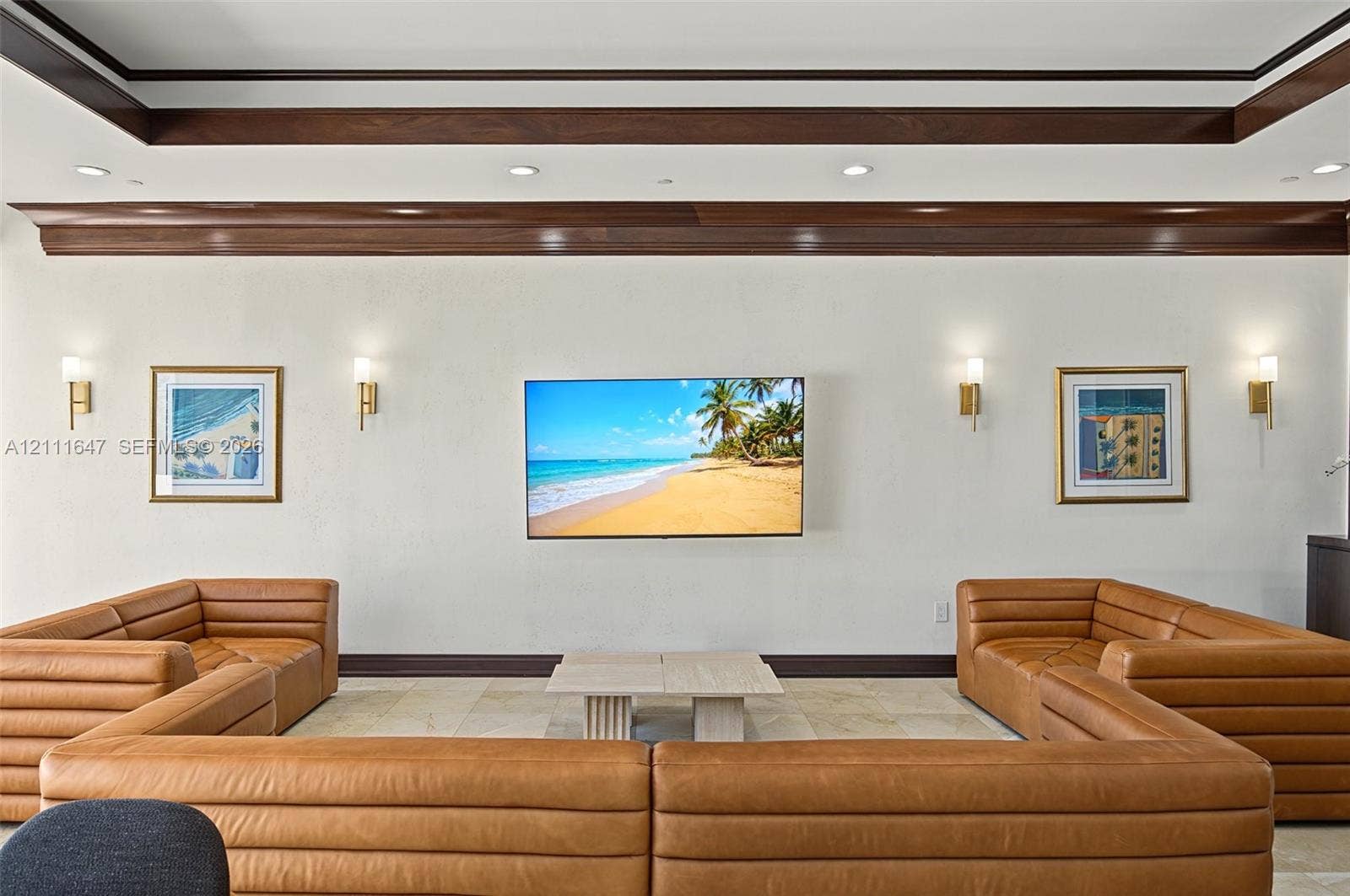 8925 Collins Avenue, #4J, Surfside, FL 33154 Tray ceiling featuring dark wood-finish trim, recessed lighting, and four wall-mounted sconces