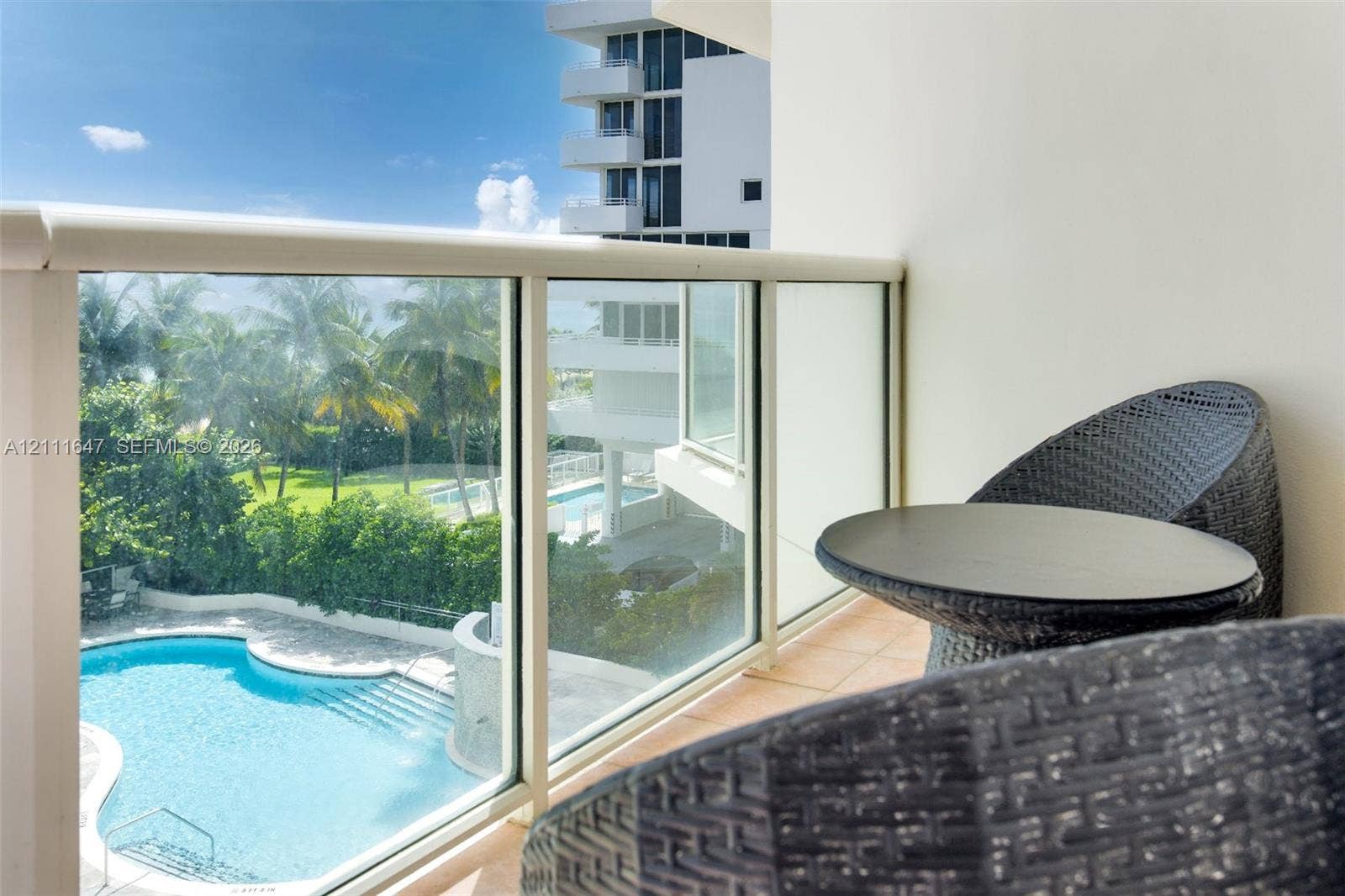 8925 Collins Avenue, #4J, Surfside, FL 33154 Balcony featuring glass panel railing and tile flooring