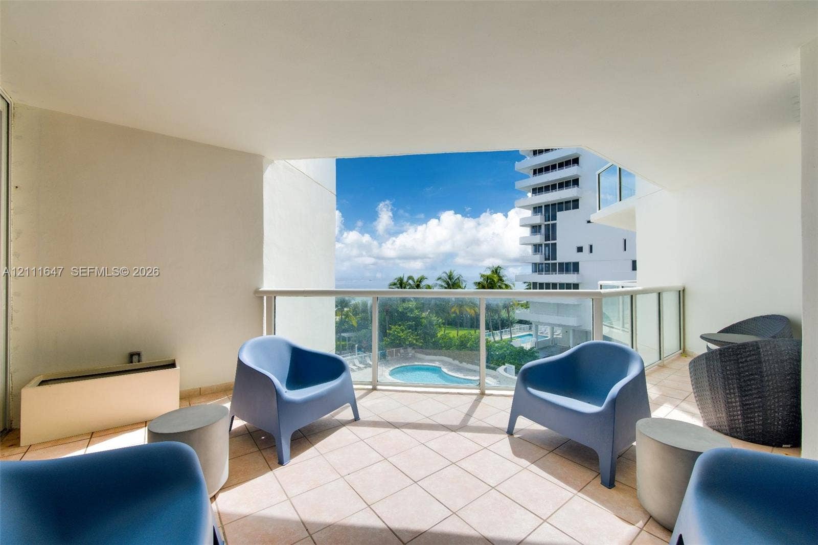 8925 Collins Avenue, #4J, Surfside, FL 33154 Covered balcony featuring tile flooring and a glass railing