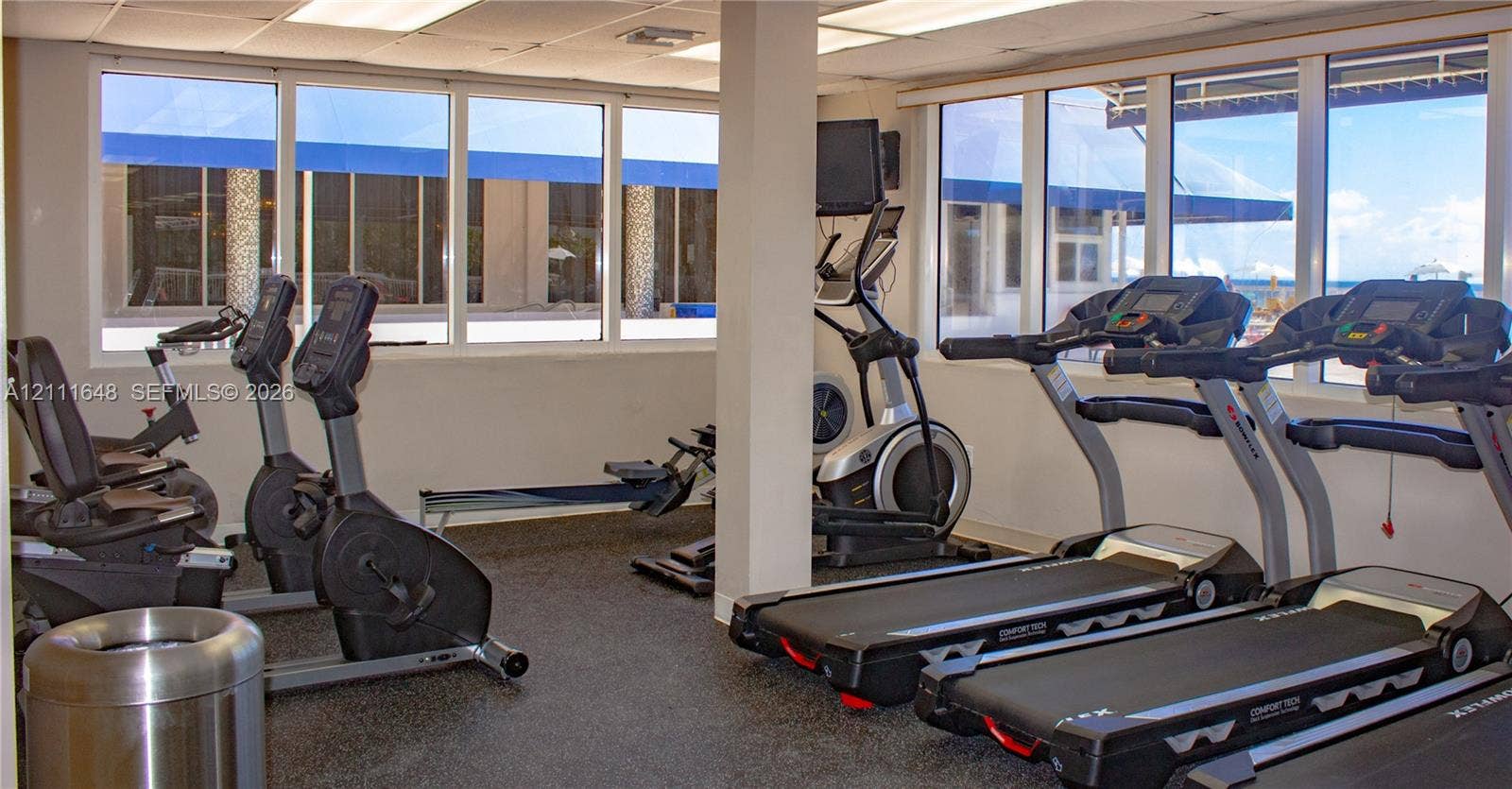 19201 Collins Avenue, #518, Sunny Isles Beach, FL 33160 Fitness center featuring rubberized flooring, expansive windows, and recessed ceiling lighting