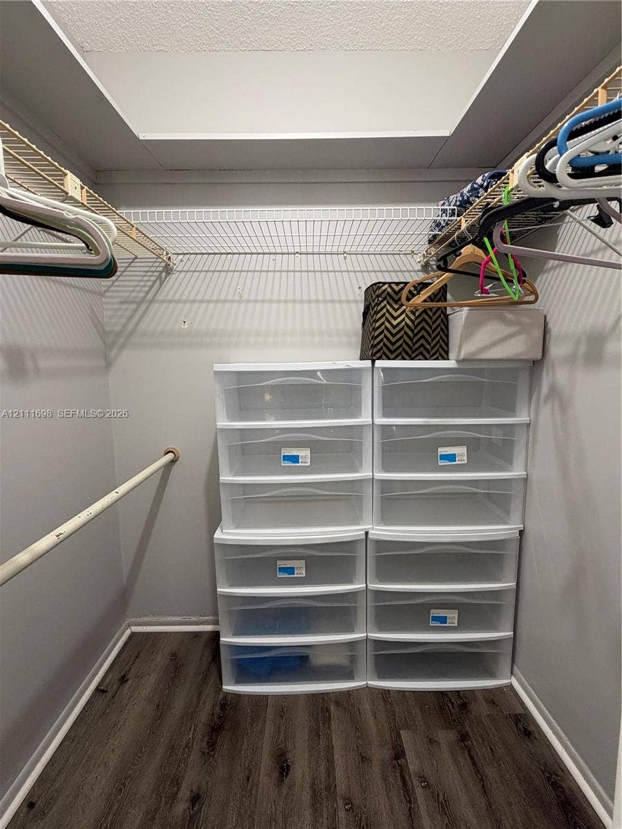 601 Three Islands Boulevard, #308, Hallandale Beach, Hallandale Beach, FL 33009 Walk-in closet featuring wood-finish flooring and installed wire shelving
