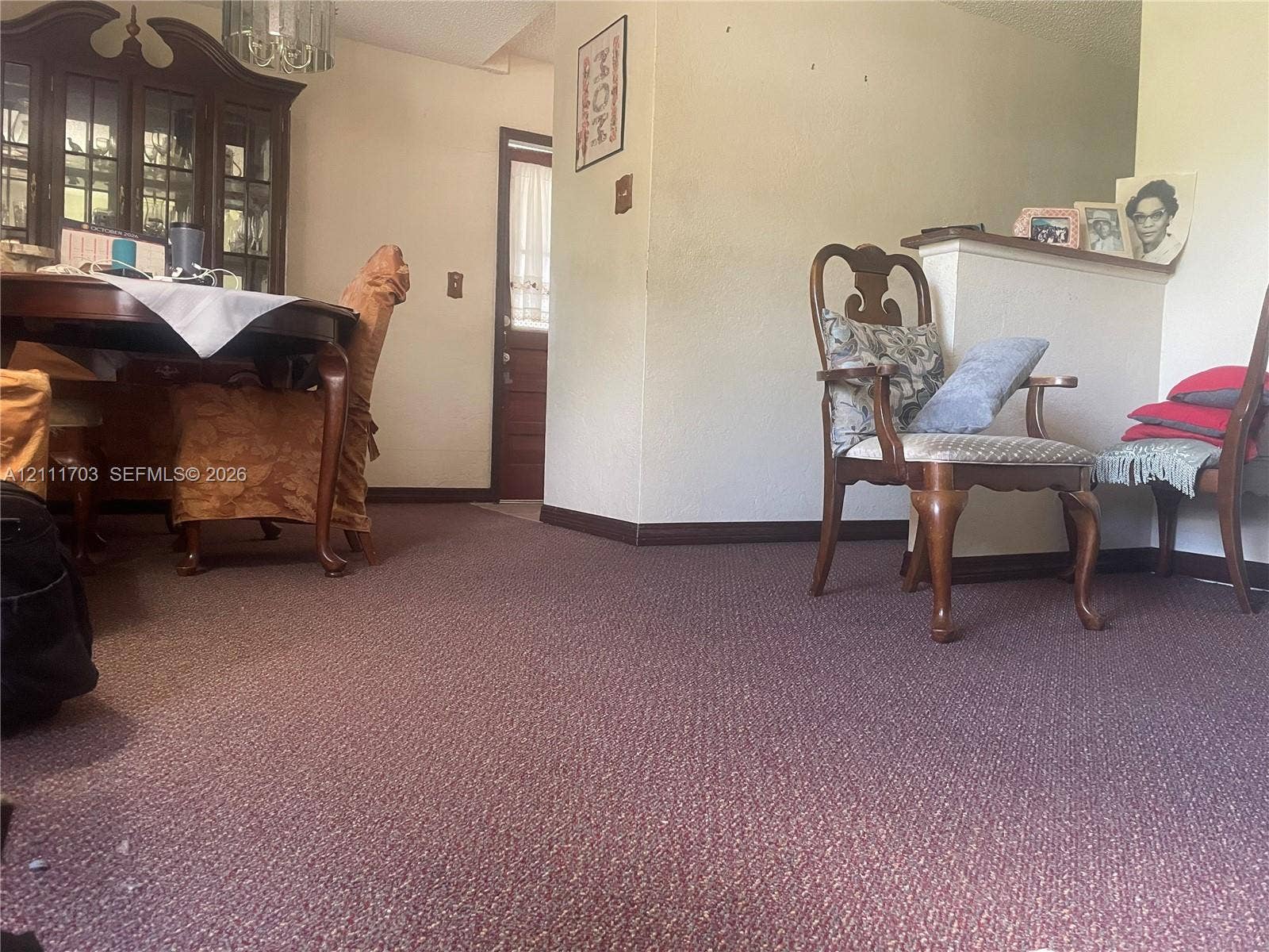 21840 SW 118th Avenue, Miami, FL 33170 Interior space featuring wall-to-wall carpeting and a half-height partition wall with a flat surface ledge