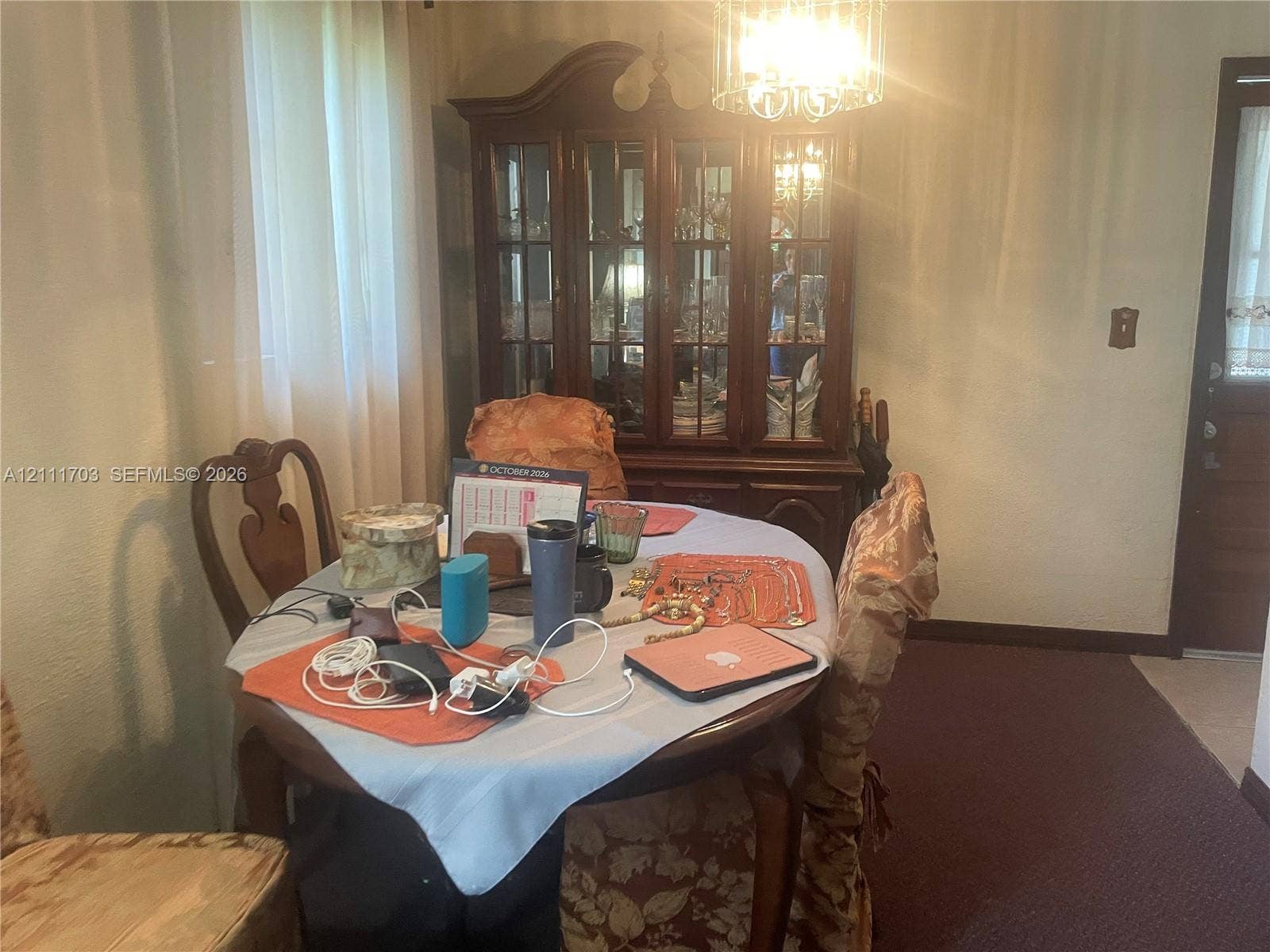 21840 SW 118th Avenue, Miami, FL 33170 Built-in glass-front china cabinet and decorative ceiling-mounted chandelier