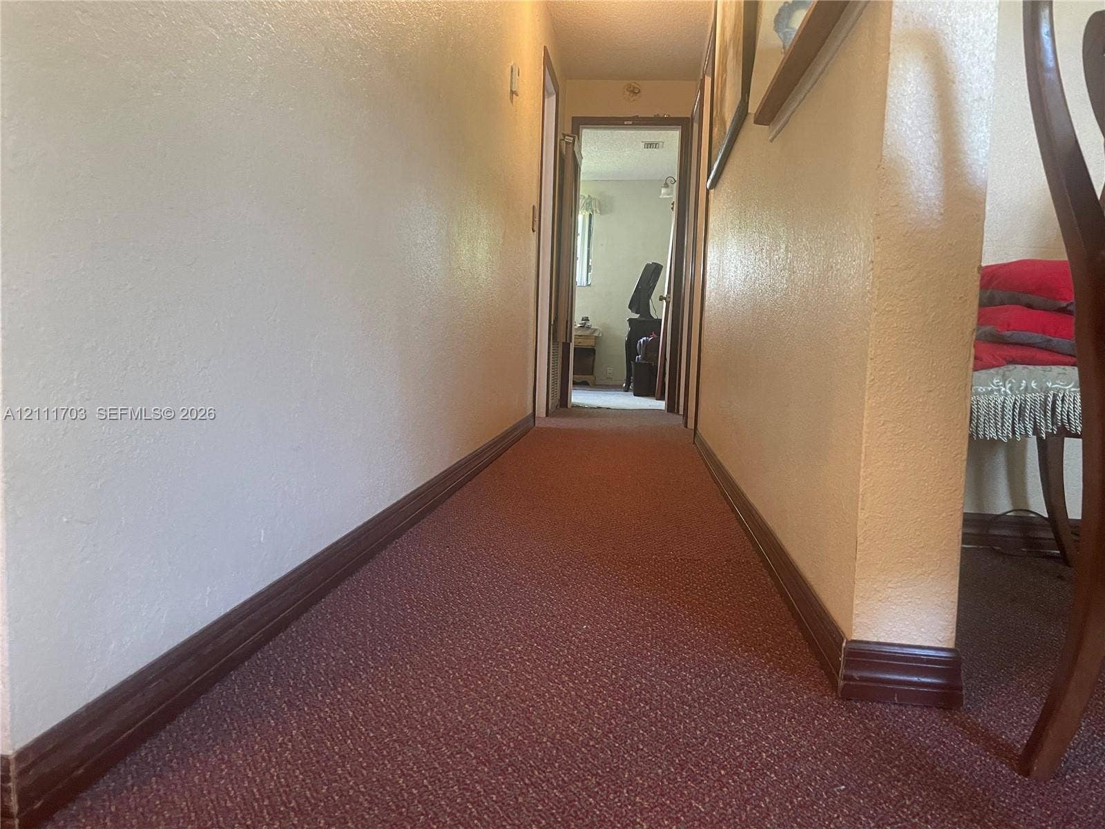 21840 SW 118th Avenue, Miami, FL 33170 Hallway featuring wall-to-wall carpeting and wood-finish trim