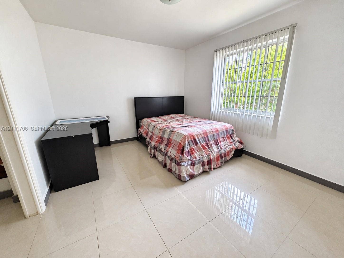 2222 SW 19th Avenue, Miami, Miami, FL 33145 Neutral-toned tile flooring, white wall finishes, and a large window featuring vertical blinds