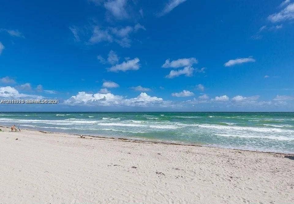 3725 S Ocean Drive, #508, Hollywood, Hollywood, FL 33019 Sandy shoreline bordering the Atlantic Ocean with clear horizon