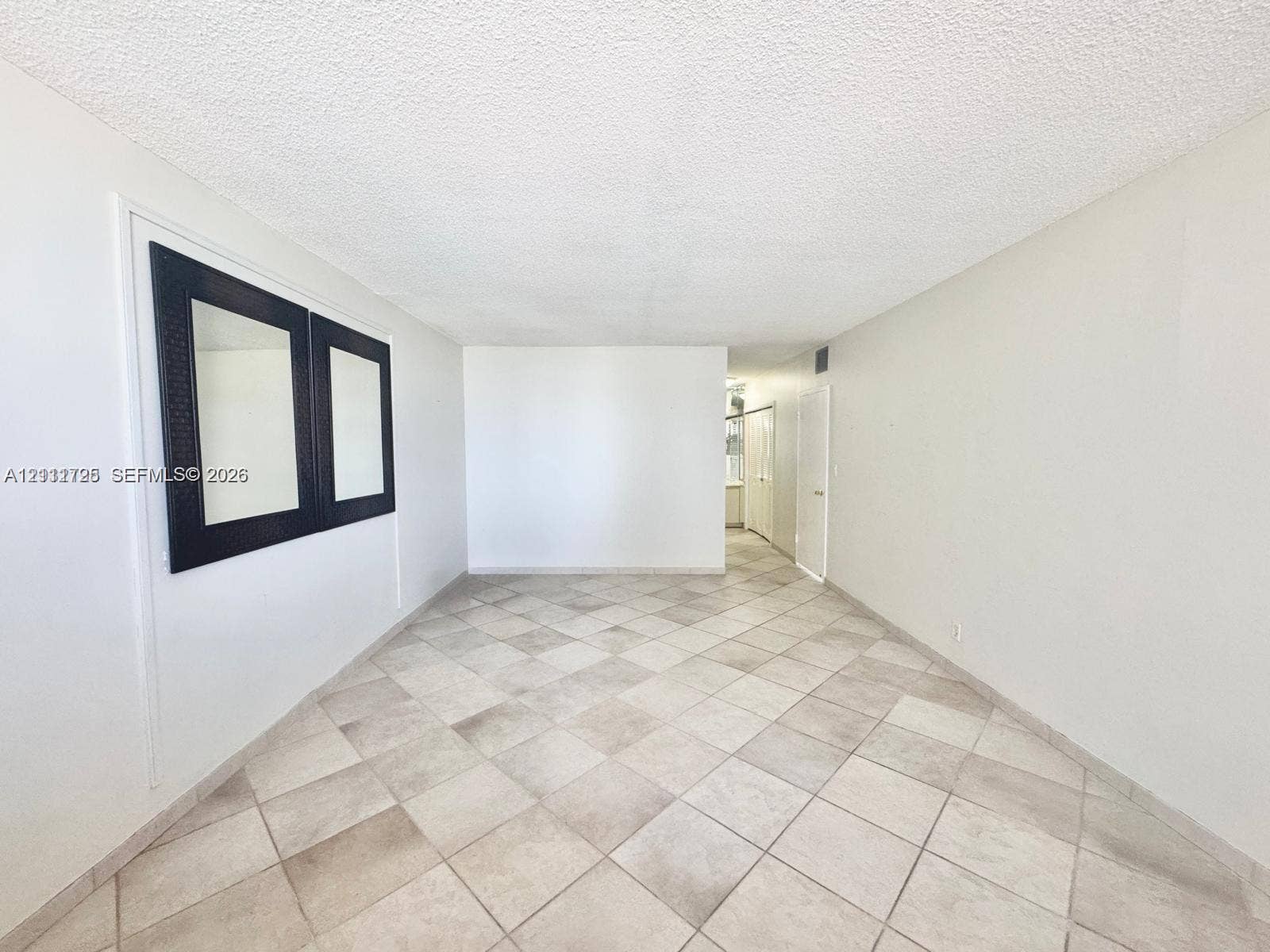 3725 S Ocean Drive, #508, Hollywood, Hollywood, FL 33019 Interior space featuring large-format ceramic tile flooring and neutral wall finishes