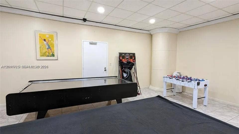 3725 S Ocean Drive, #508, Hollywood, Hollywood, FL 33019 Interior space featuring neutral wall tones, tile flooring, recessed ceiling lighting, and a drop ceiling system