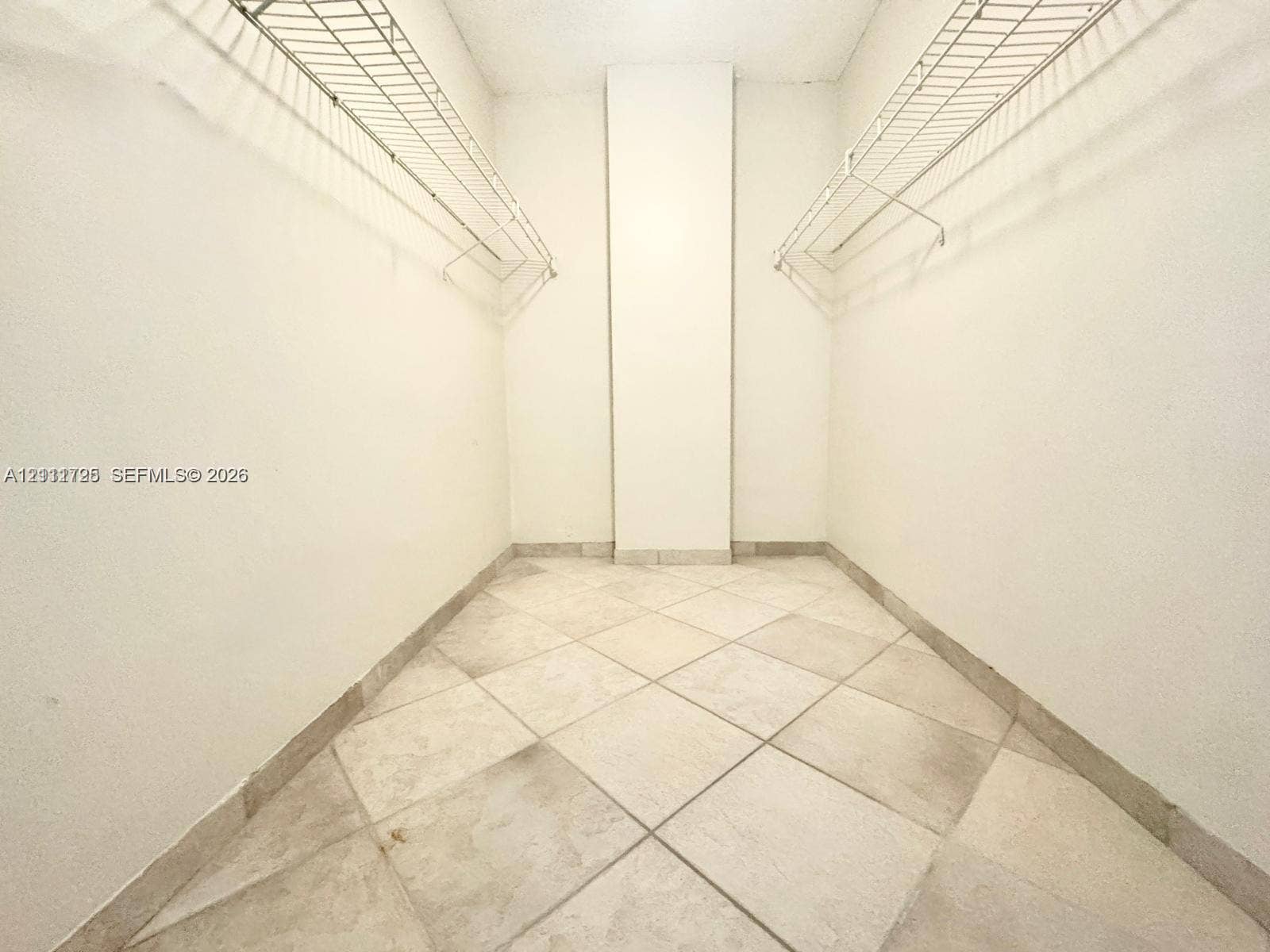 3725 S Ocean Drive, #508, Hollywood, Hollywood, FL 33019 Storage space featuring neutral large-format tile flooring and dual tiered wire shelving systems