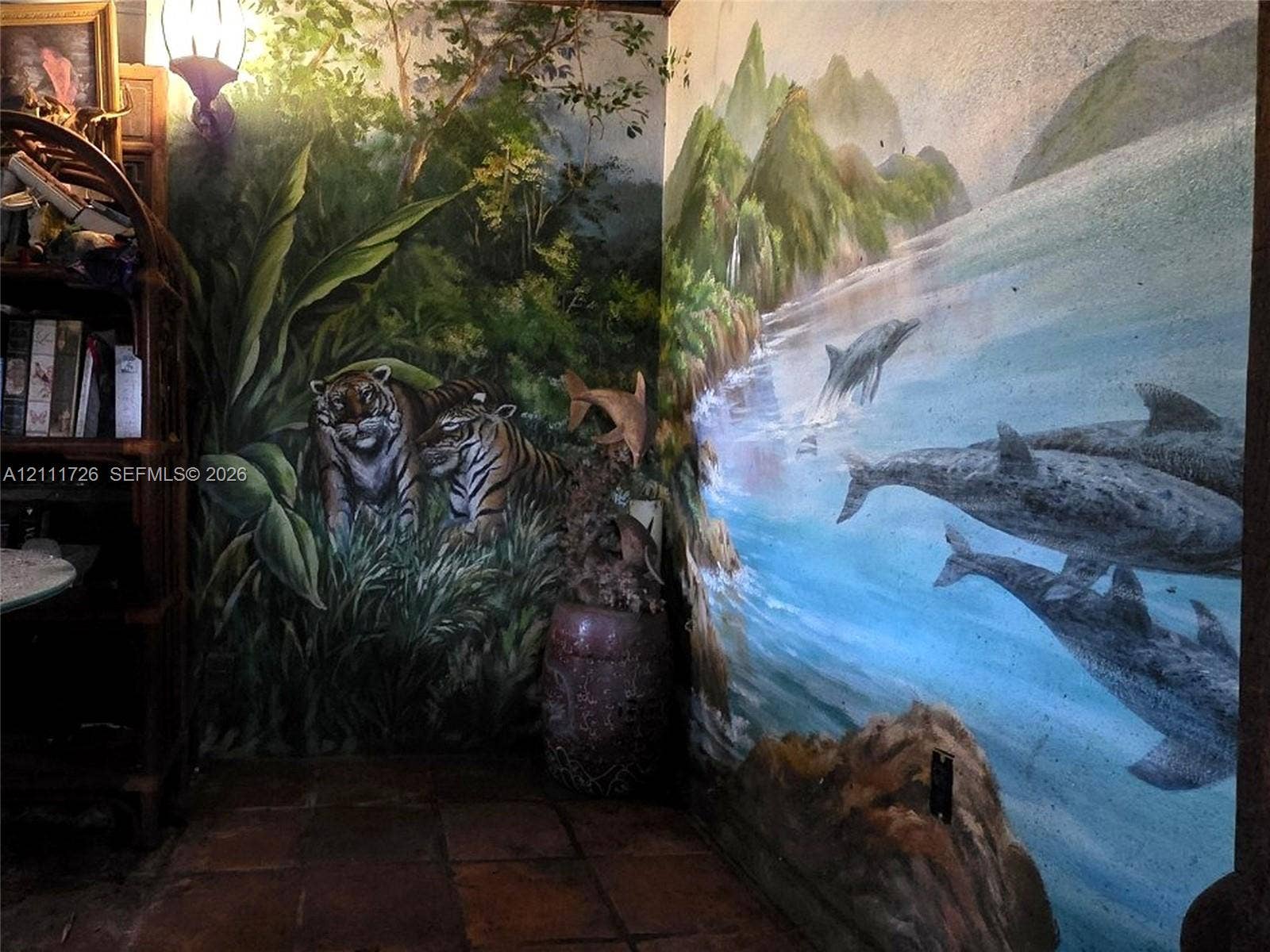 2399 NE 5th Avenue, Boca Raton, FL 33431 Custom wall murals featuring detailed nature and wildlife imagery, accompanied by tile flooring and a wall-mounted light fixture
