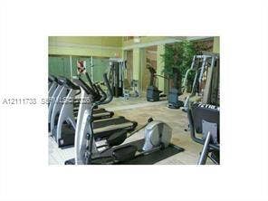 460 S Park Road, #308, Hollywood, Hollywood, FL 33021 Fitness center featuring tile flooring, mirrored walls, and oversized windows