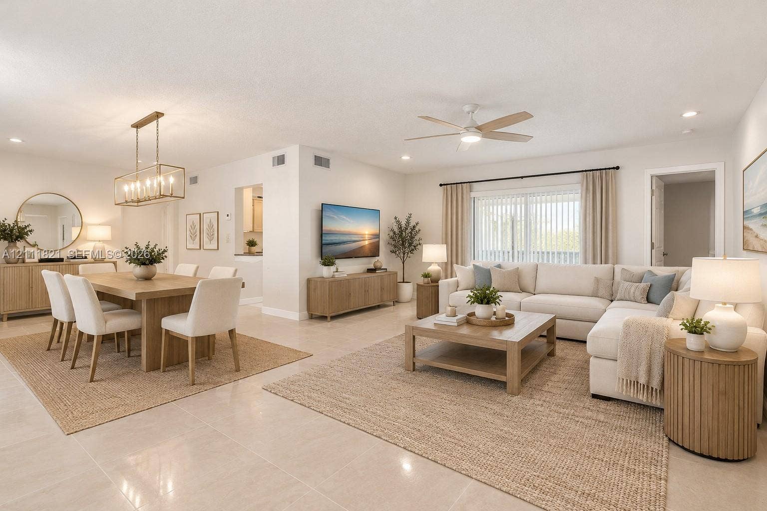 Open-concept living and dining area virtually staged
