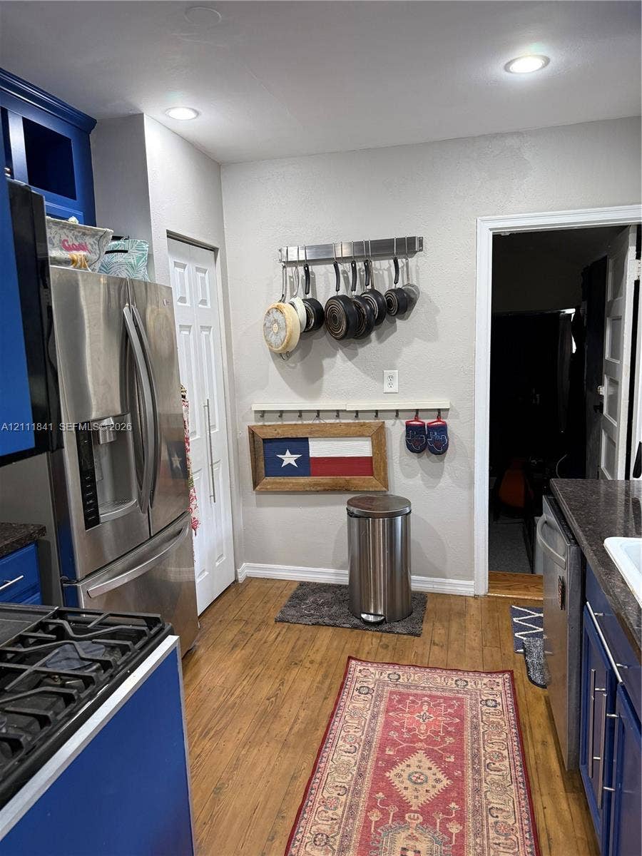 12015 NE 6th Avenue, Biscayne Park, FL 33161 Kitchen featuring wood-finish flooring, recessed lighting, and stainless steel appliances