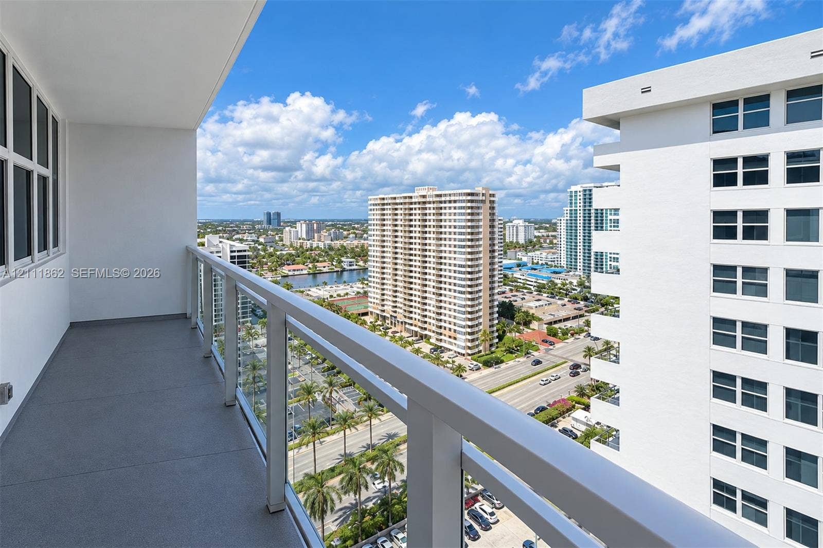 2030 S Ocean Drive, #2004, Hallandale Beach, FL 33009 Covered balcony with a solid-surface floor and perimeter glass-panel railing