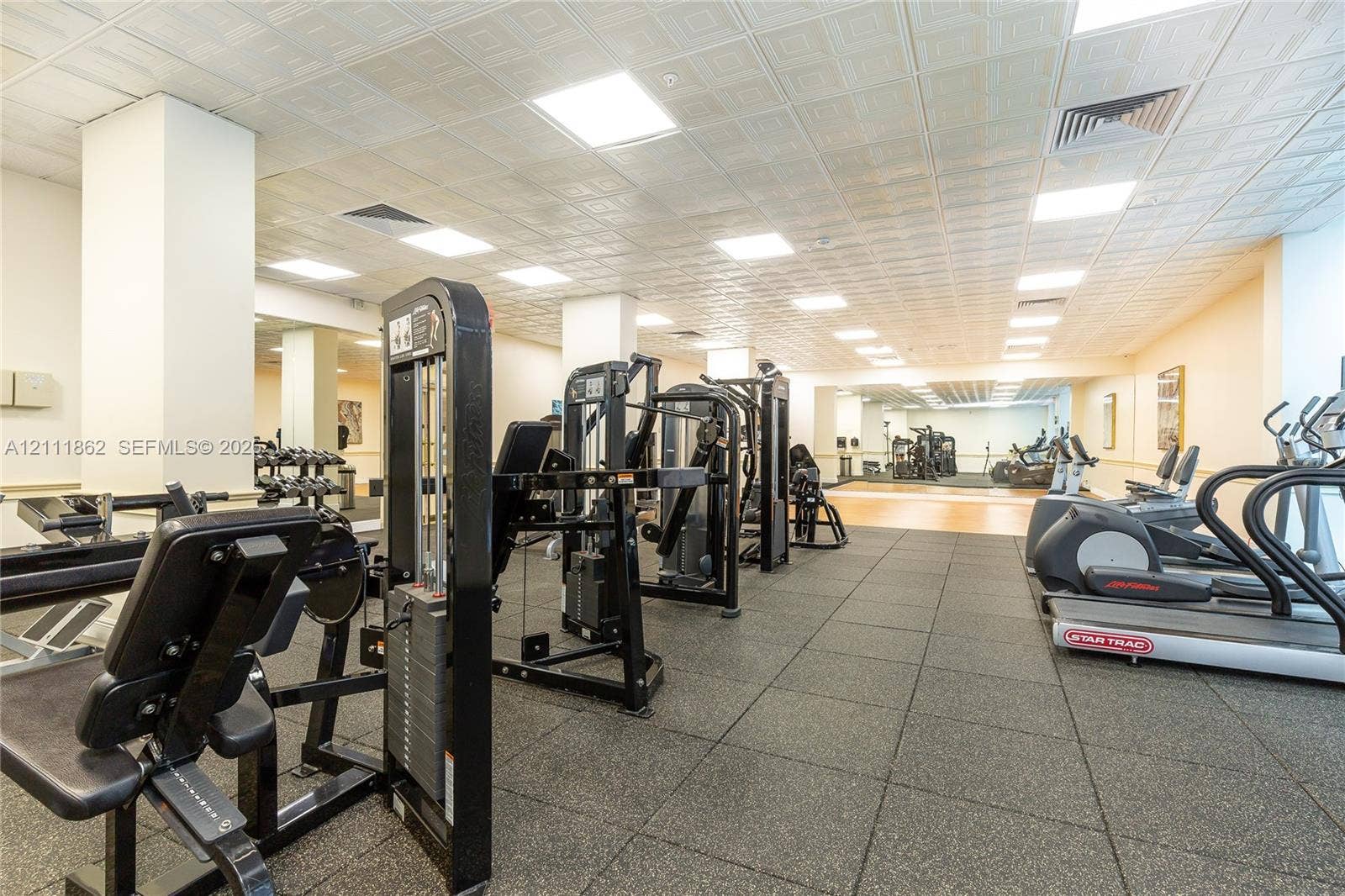 2030 S Ocean Drive, #2004, Hallandale Beach, FL 33009 Fitness facility featuring high-contrast rubber flooring, coffered ceiling tiles, and recessed lighting