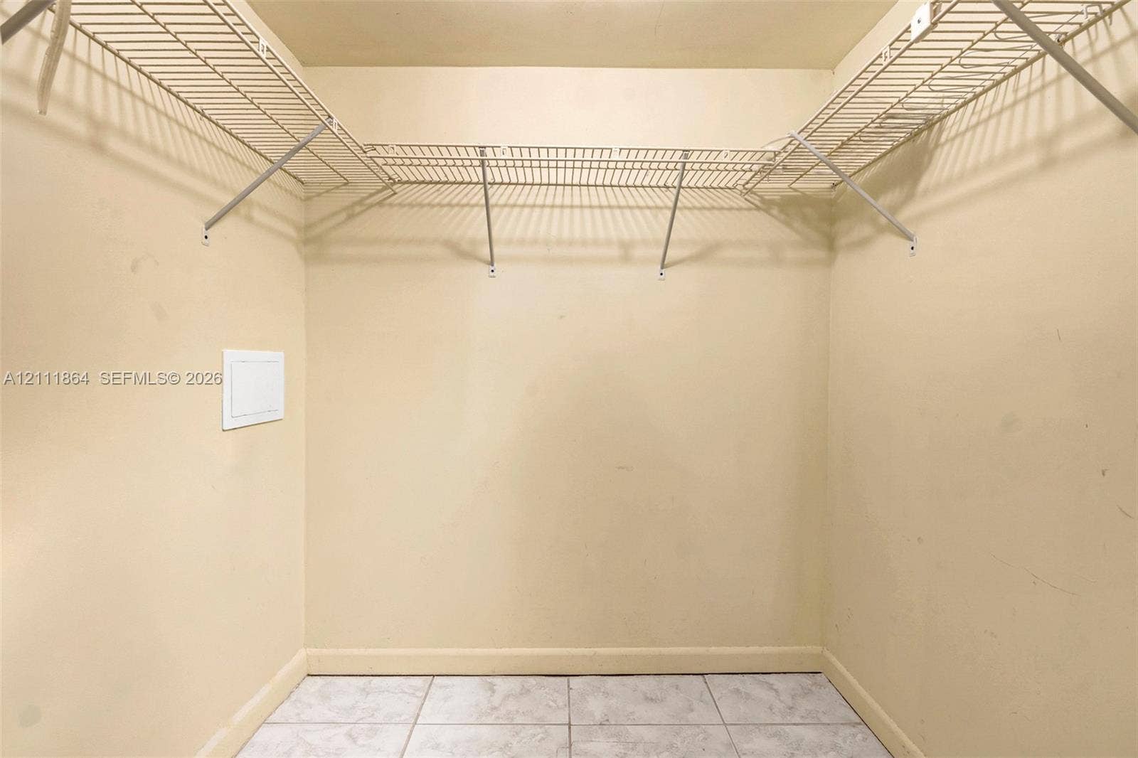 6195 Rock Island Road, #104, Tamarac, FL 33319 Storage area featuring white wire shelving and tile flooring