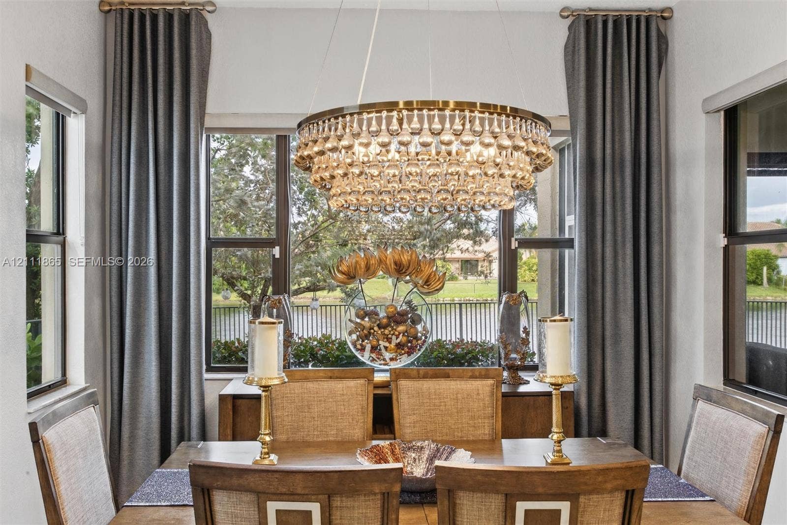 1034 SW 113th Avenue, Pembroke Pines, FL 33025 Comfortable Dining Area - with lots of natural light, a crystal chandelier and lake view.