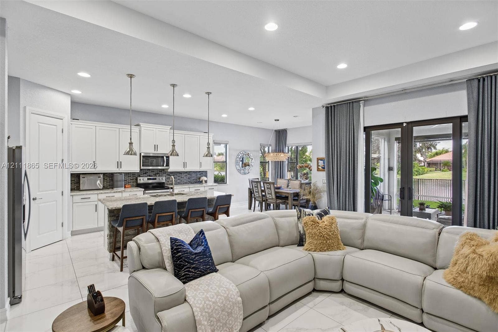 1034 SW 113th Avenue, Pembroke Pines, FL 33025 View of open concept living space - Living, dining, kitchen.