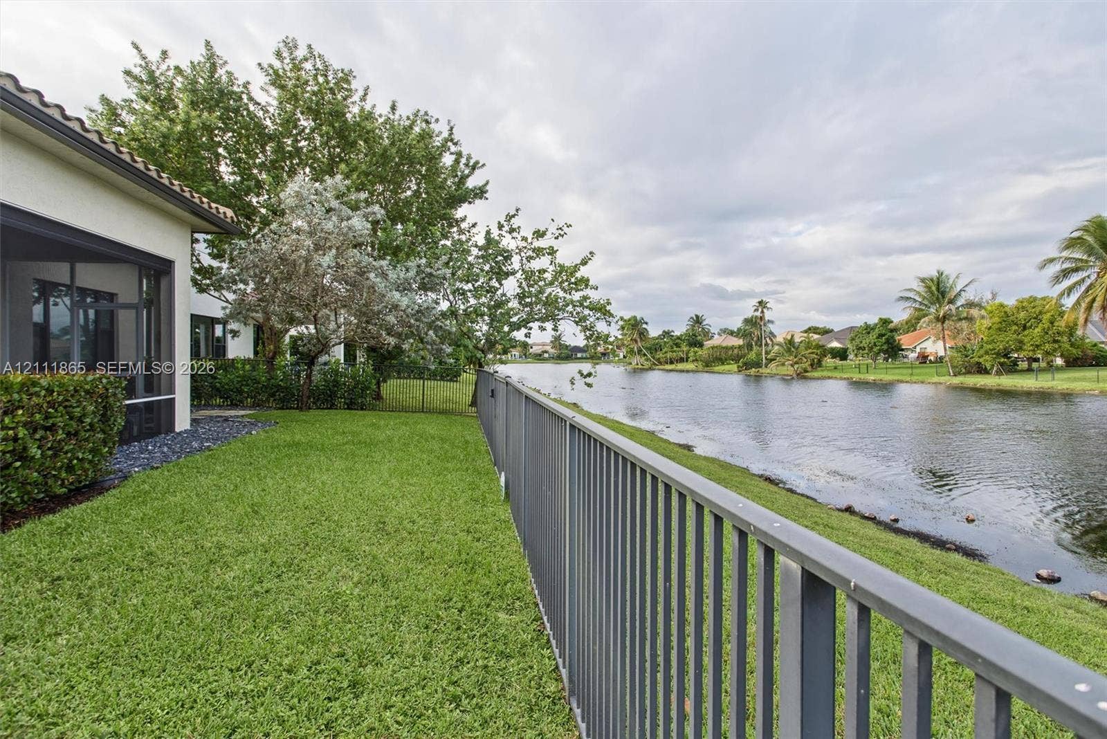 1034 SW 113th Avenue, Pembroke Pines, FL 33025 lake view from the back yard