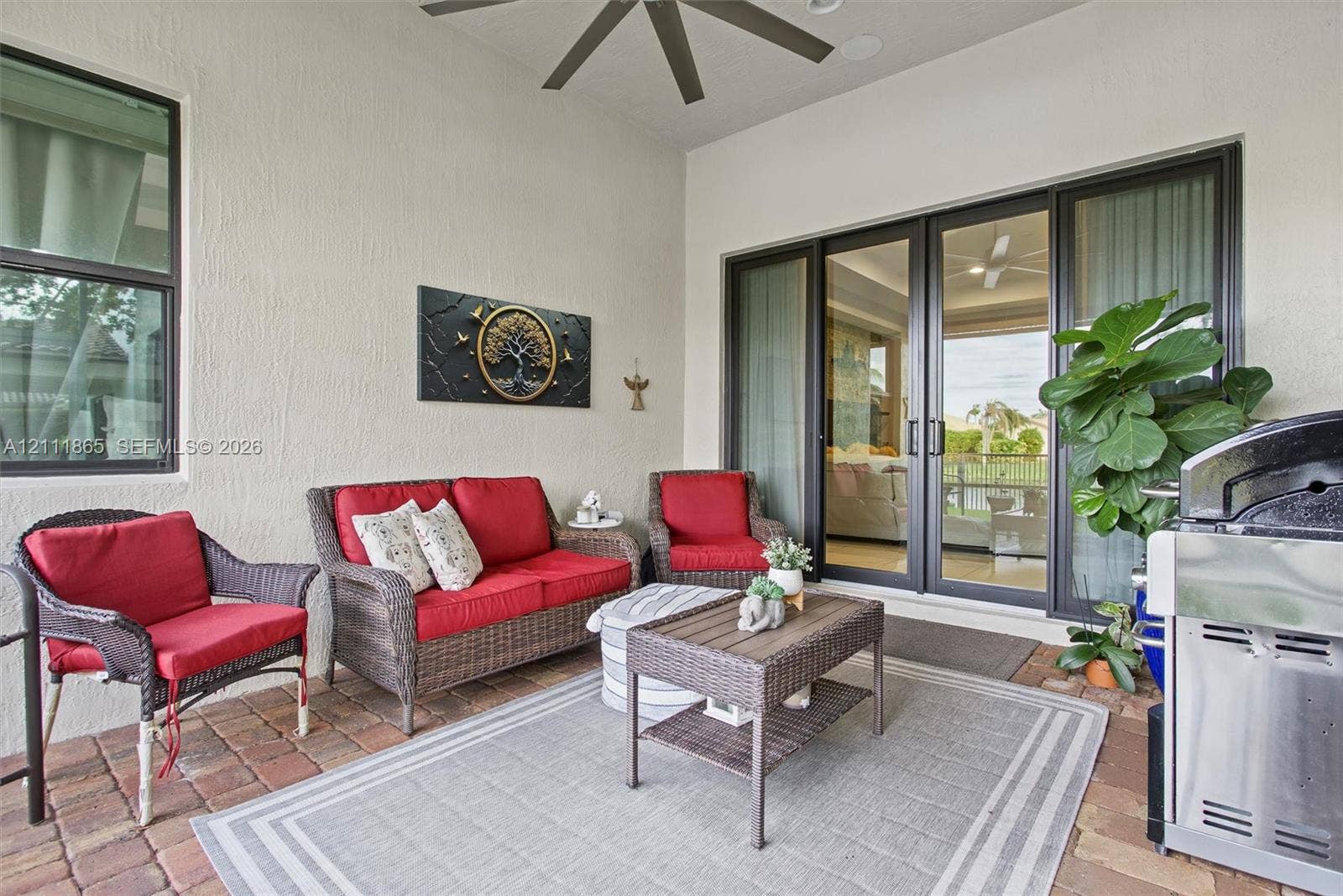 1034 SW 113th Avenue, Pembroke Pines, FL 33025 Screened lanai with lighted ceiling fan.