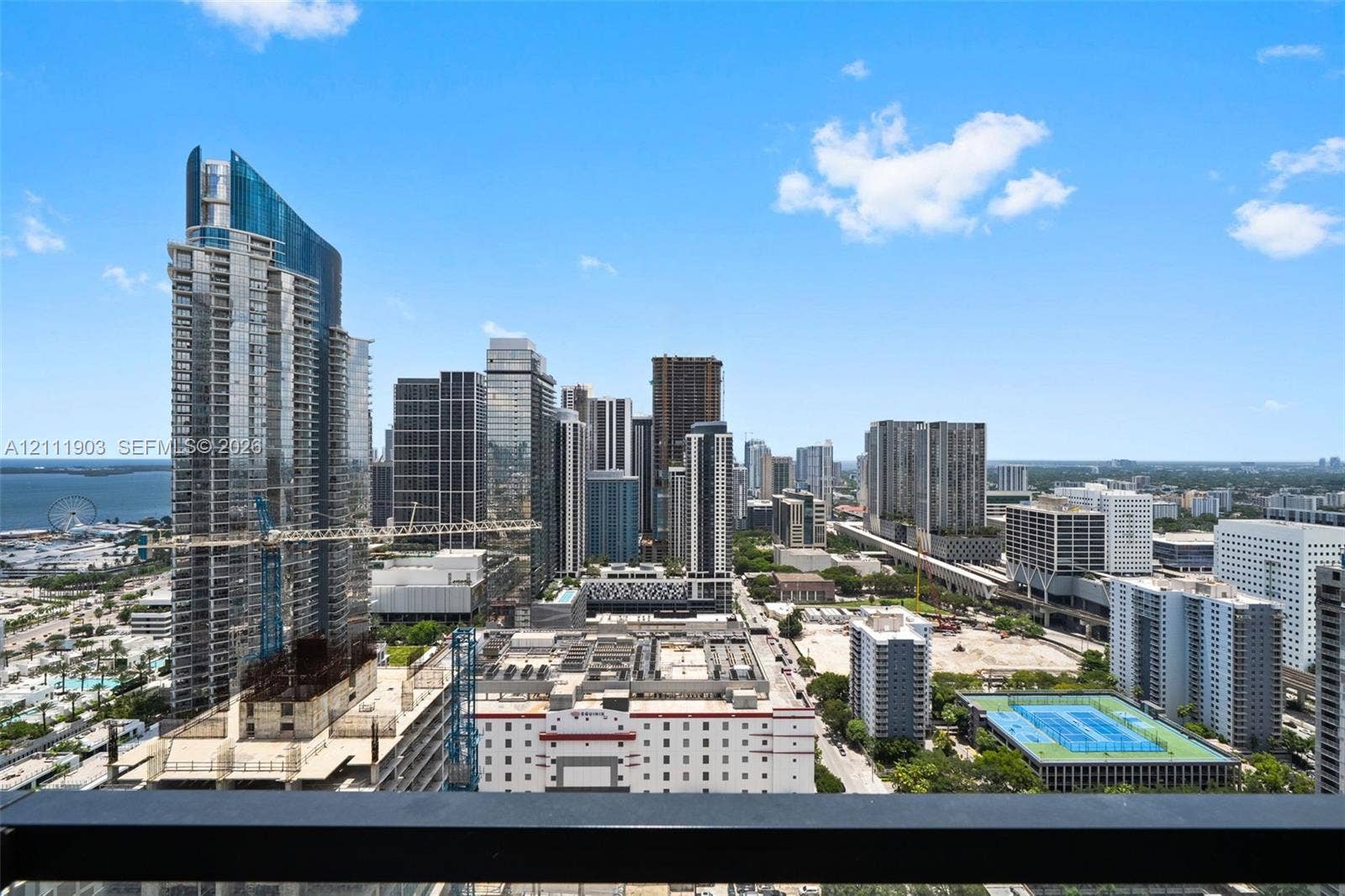 20 NE 11th Street, #4308, Miami, FL 33132 Elevated urban perspective featuring expansive city skyline, coastal waters, and high-rise architecture