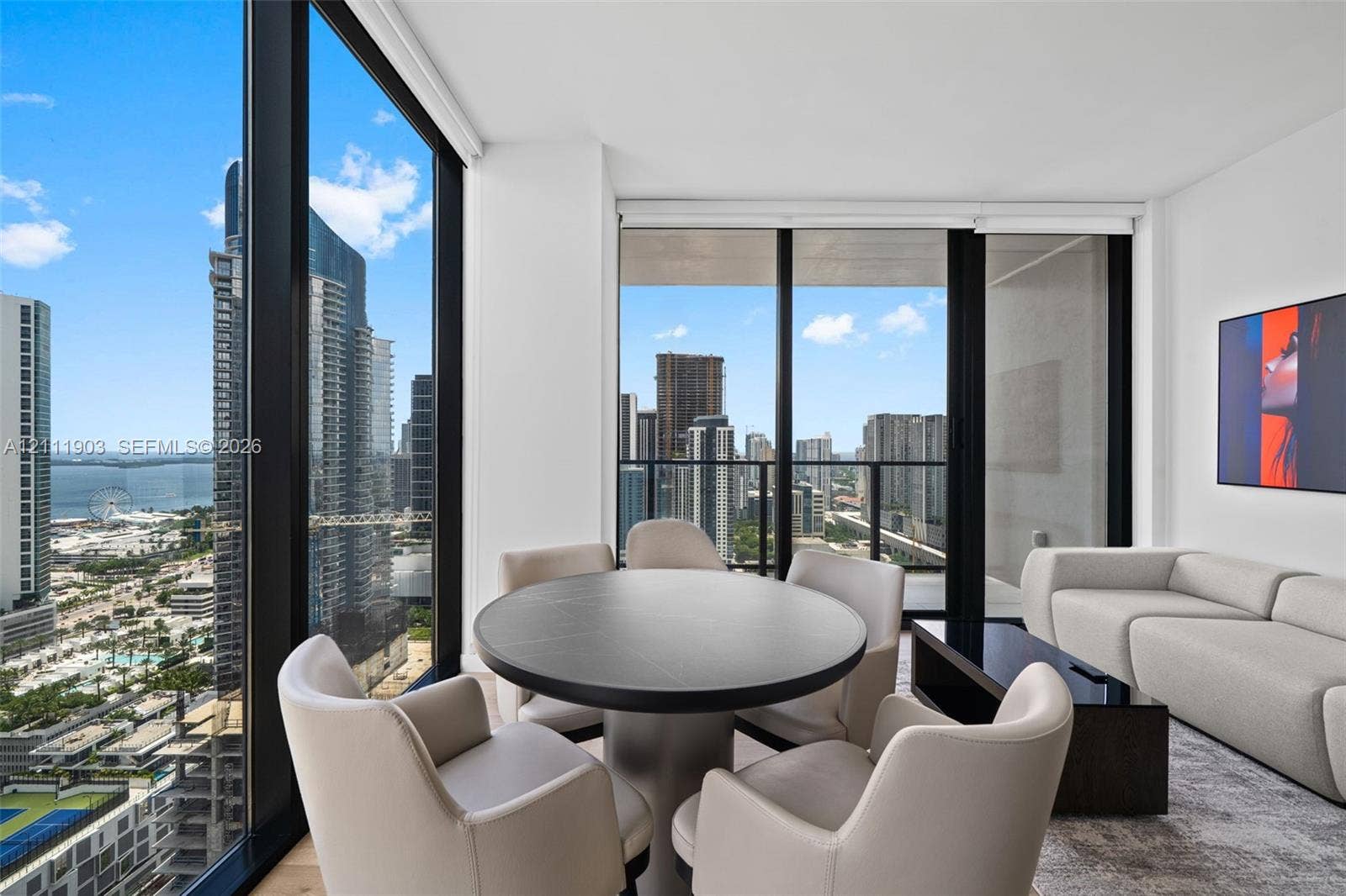 20 NE 11th Street, #4308, Miami, FL 33132 Floor-to-ceiling windows, wrap-around glazing, urban skyline scenery, and integrated balcony access