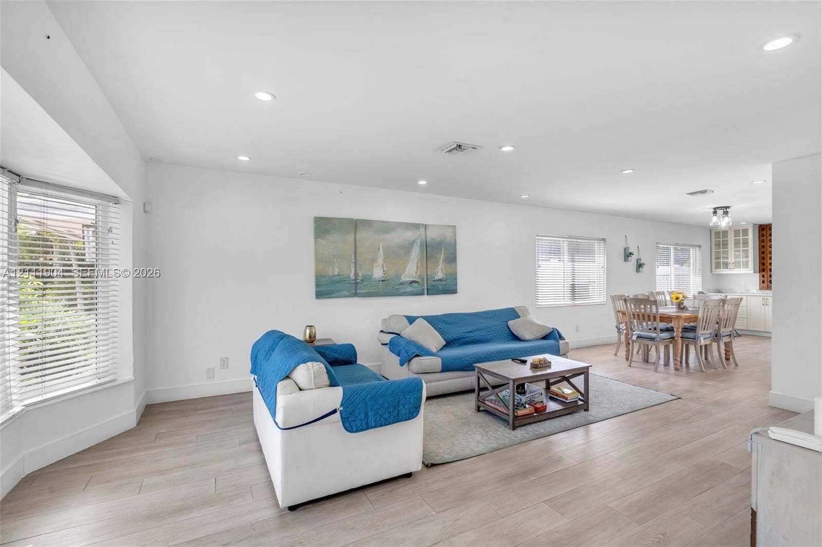 821 Harrison Street, Hollywood, FL 33019 Open-concept interior featuring wood-finish flooring, recessed lighting, and a bay window