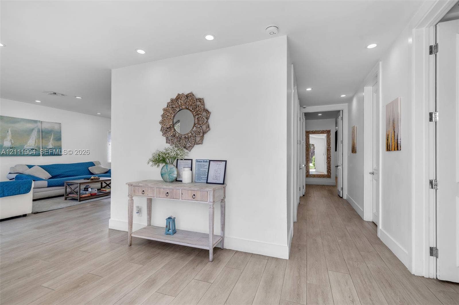 821 Harrison Street, Hollywood, FL 33019 Interior hallway featuring wood-finish flooring, crisp white walls, and recessed ceiling lighting