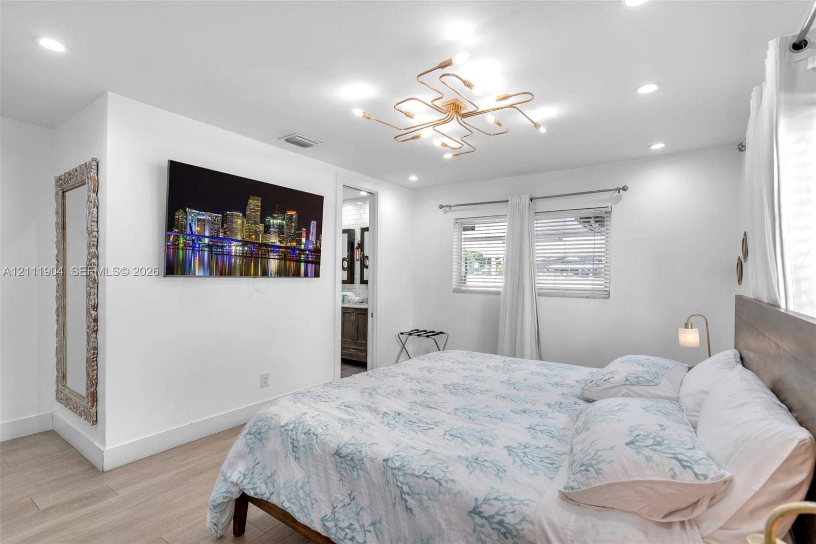 821 Harrison Street, Hollywood, FL 33019 Bedroom featuring wood-finish flooring, recessed lighting, and a multi-arm geometric ceiling fixture