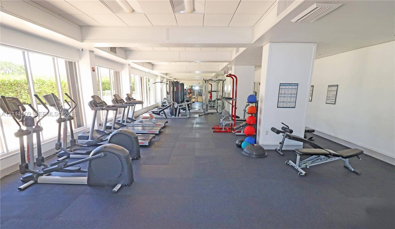 2851 NE 183rd Street, #1708E, Aventura, FL 33160 Fitness center featuring wall-to-wall rubber flooring, floor-to-ceiling windows, and recessed ceiling lighting