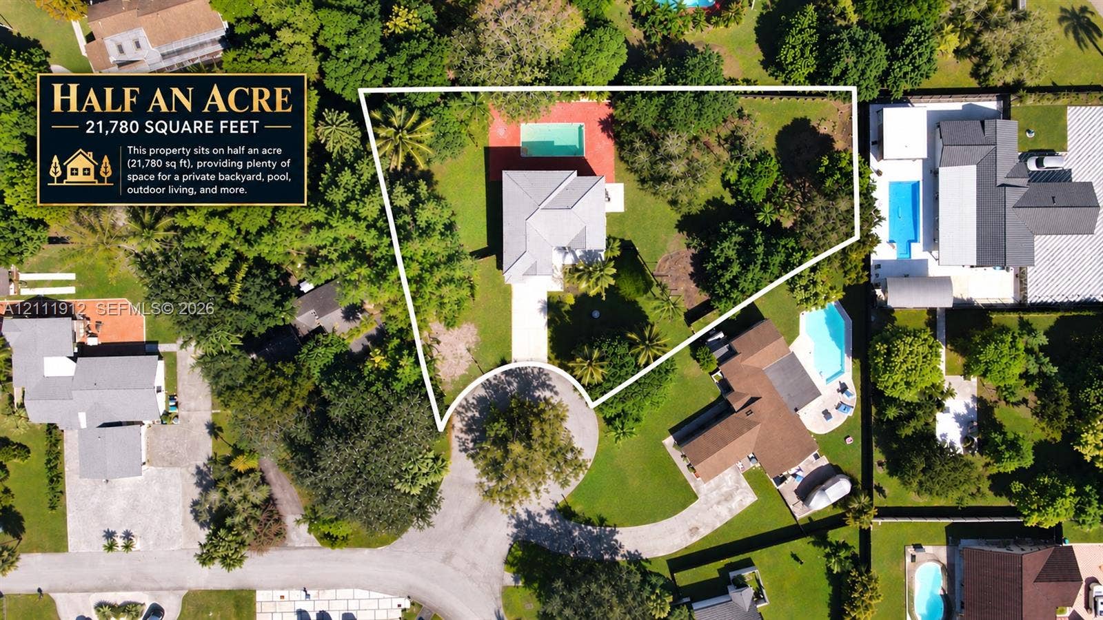 15681 SW 147th Court, Miami, FL 33187 Half-acre lot featuring a swimming pool, expansive grounds, mature trees, and a concrete driveway