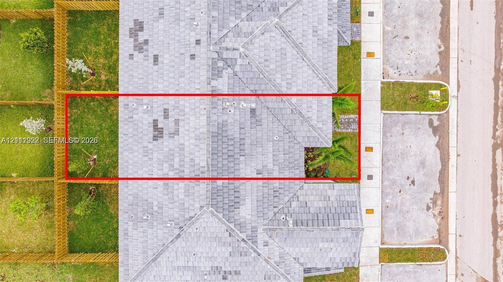 16281 SW 292nd Street, Homestead, FL 33033 Aerial view featuring an asphalt shingle roof, a fenced perimeter, and a grass-covered outdoor area