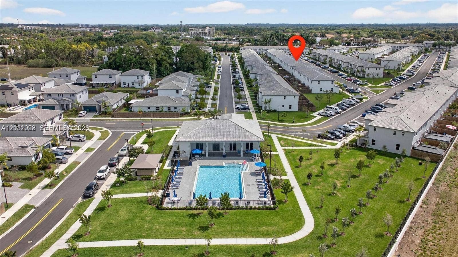 16281 SW 292nd Street, Homestead, FL 33033 Community pool featuring a paved deck and professional landscaping