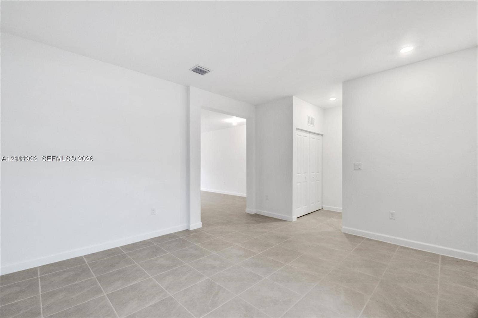 16281 SW 292nd Street, Homestead, FL 33033 Neutral-toned tile flooring, recessed ceiling lighting, and built-in closet with multi-panel doors