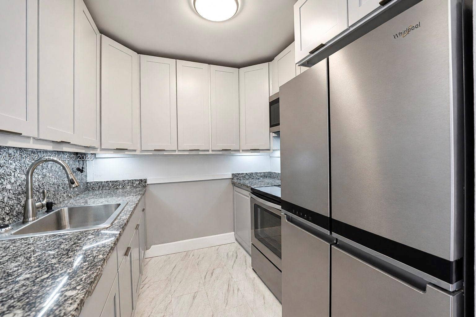 Kitchen solid wood cabinetry with additional built in, stone countertops, appliances 1-2 years old
