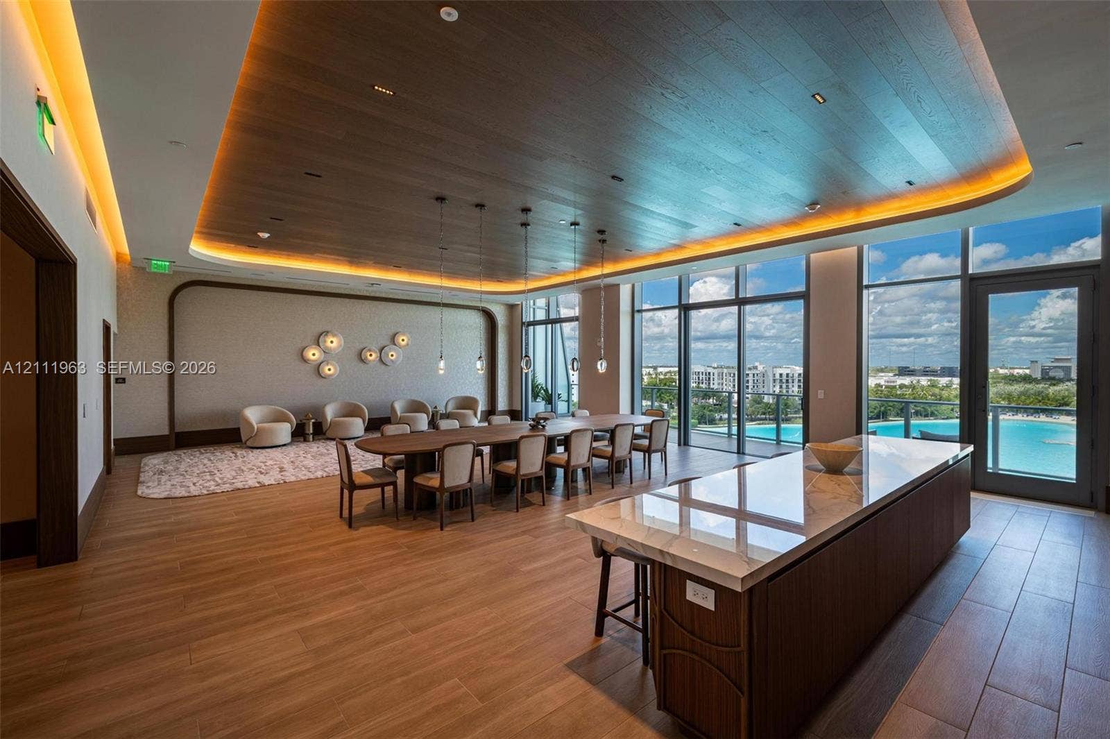 Wood-finish ceiling with recessed cove lighting, floor-to-ceiling windows, custom built-in arched shelving, and wood-finish flooring