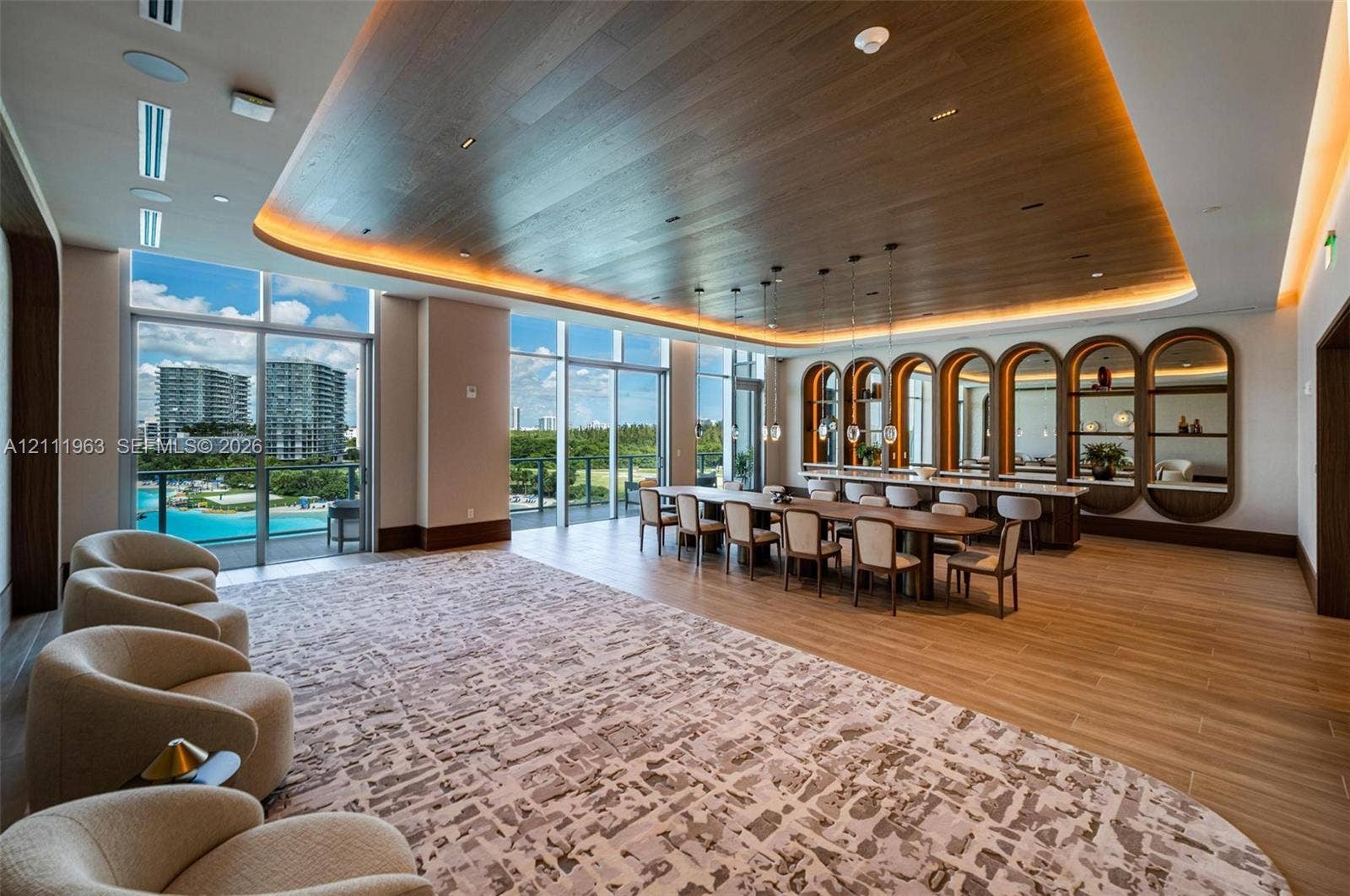 Floor-to-ceiling glass walls, wood-paneled ceiling with recessed cove lighting, built-in arched display shelving with integrated lighting, wood-finish tile flooring, and custom pendant light fixtures