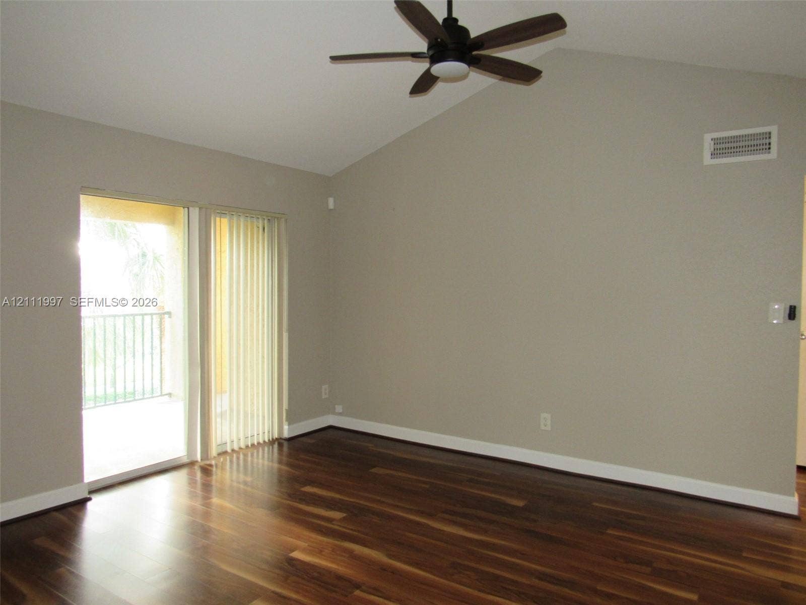 733 Riverside Drive, #1232, Coral Springs, Coral Springs, FL 33071 Vaulted ceilings, wood-finish flooring, ceiling fan with integrated lighting, and sliding glass door leading to a balcony