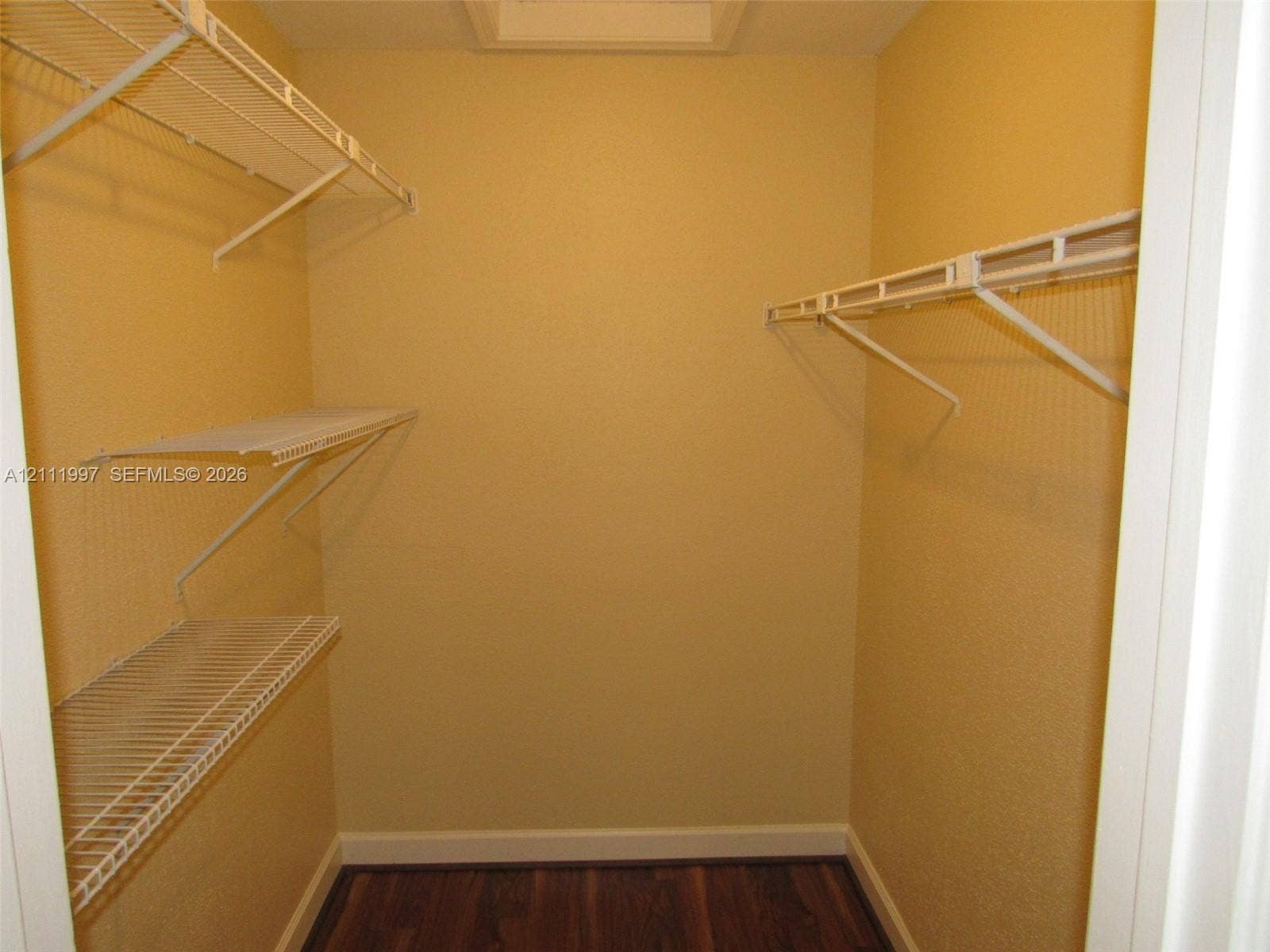 733 Riverside Drive, #1232, Coral Springs, Coral Springs, FL 33071 Storage area featuring white wire shelving units and wood-finish flooring