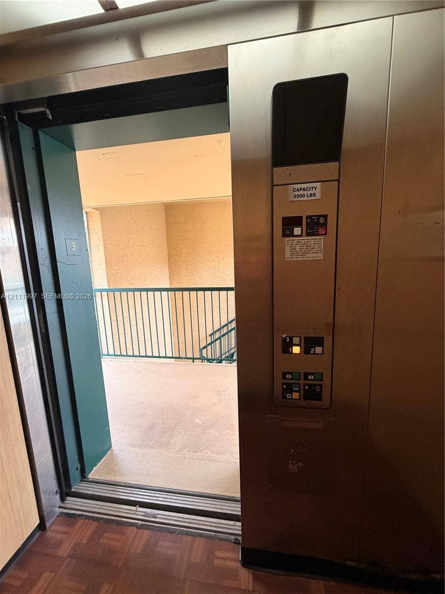 733 Riverside Drive, #1232, Coral Springs, Coral Springs, FL 33071 Elevator featuring a stainless steel control panel, 2500-pound weight capacity, and parquet flooring
