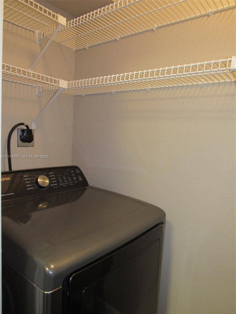 733 Riverside Drive, #1232, Coral Springs, Coral Springs, FL 33071 Built-in white wire shelving providing tiered storage
