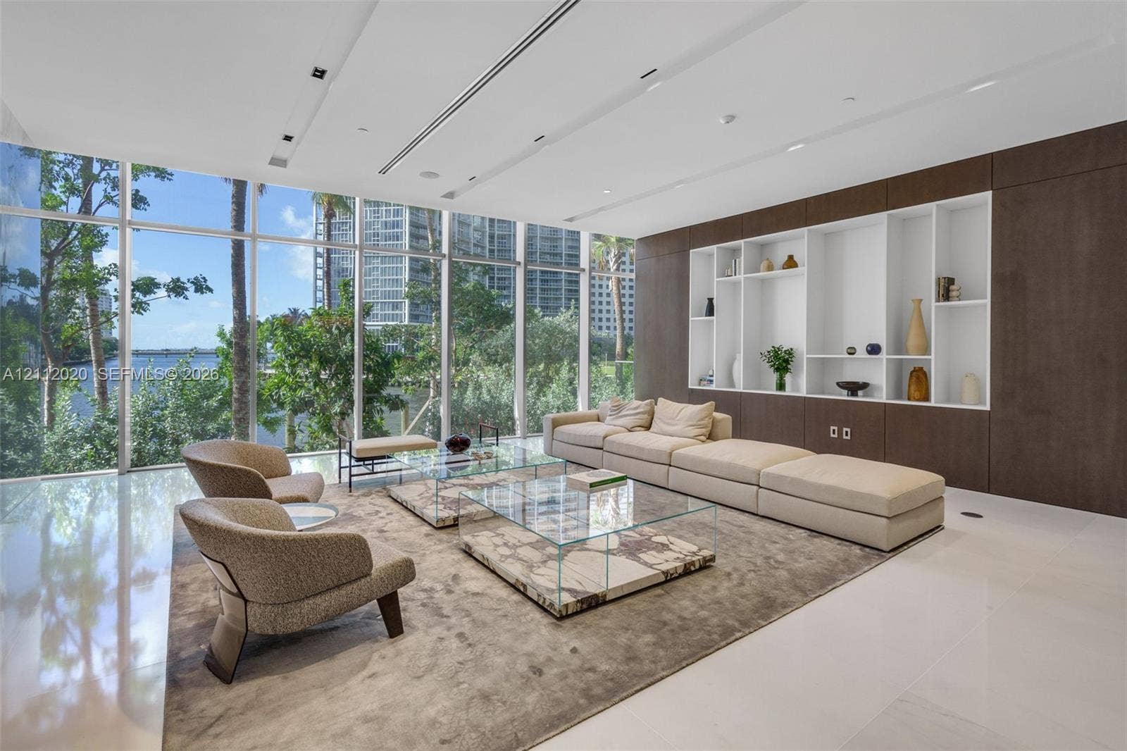 300 Biscayne Blvd Way, #4202, Miami, Miami, FL 33131 Floor-to-ceiling glass windows, built-in floor-to-ceiling cabinetry with integrated display shelving, large-format tile flooring, and recessed ceiling lighting