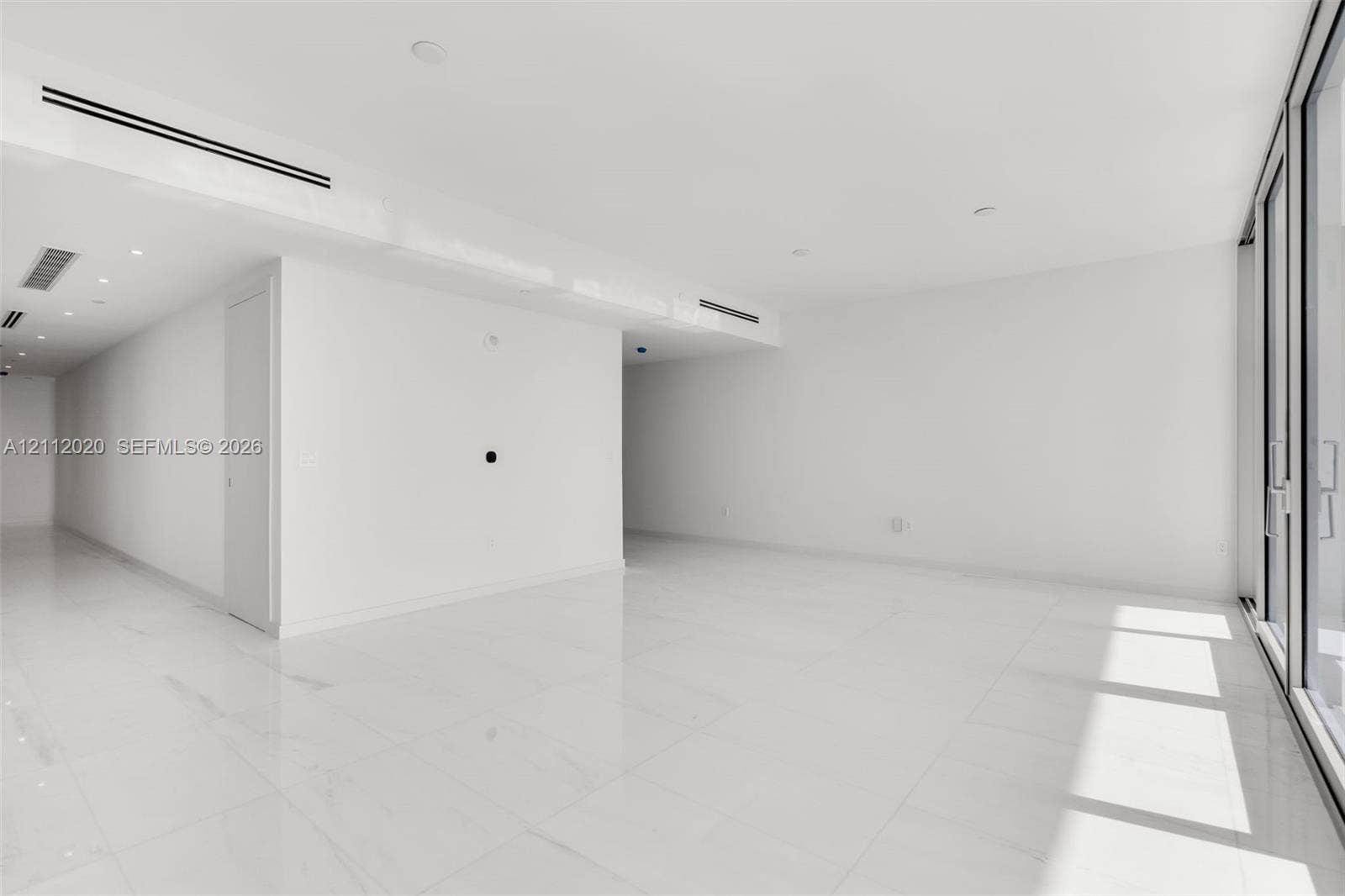 300 Biscayne Blvd Way, #4202, Miami, Miami, FL 33131 Interior space featuring large-format tile flooring, recessed ceiling lighting, and floor-to-ceiling glass paneling