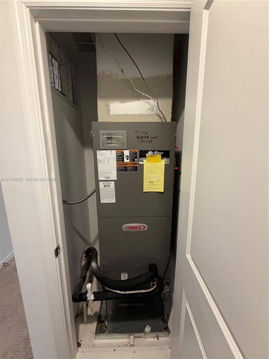 254 Mandovis Street, Davenport, Davenport, FL 33837 Lennox heating and cooling unit housed within a dedicated mechanical closet