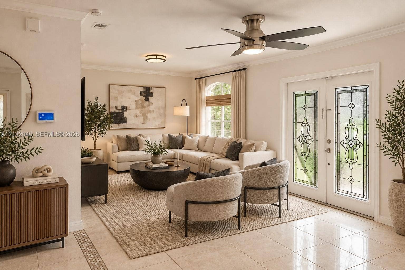 Double French doors featuring stained glass inserts, crown molding, a brushed nickel ceiling fan with integrated lighting, a flush-mount circular fixture, and polished tile flooring