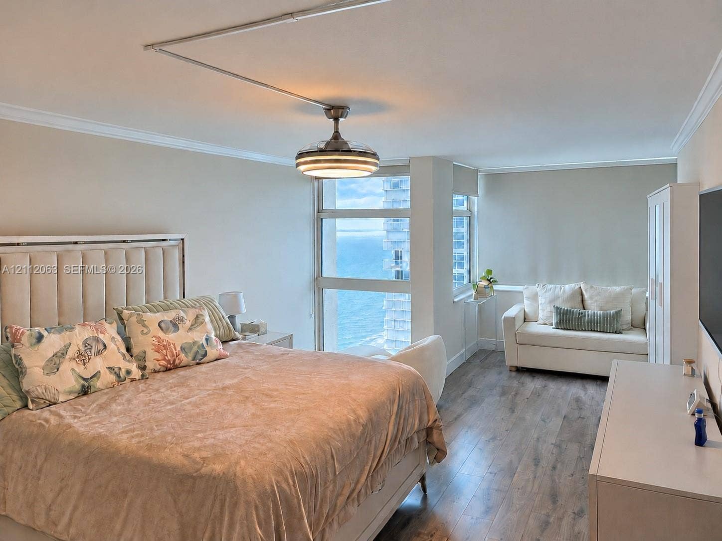 1360 S Ocean Boulevard, #2503, Pompano Beach, Pompano Beach, FL 33062 Floor-to-ceiling windows with water orientation, wood-finish flooring, and crown molding