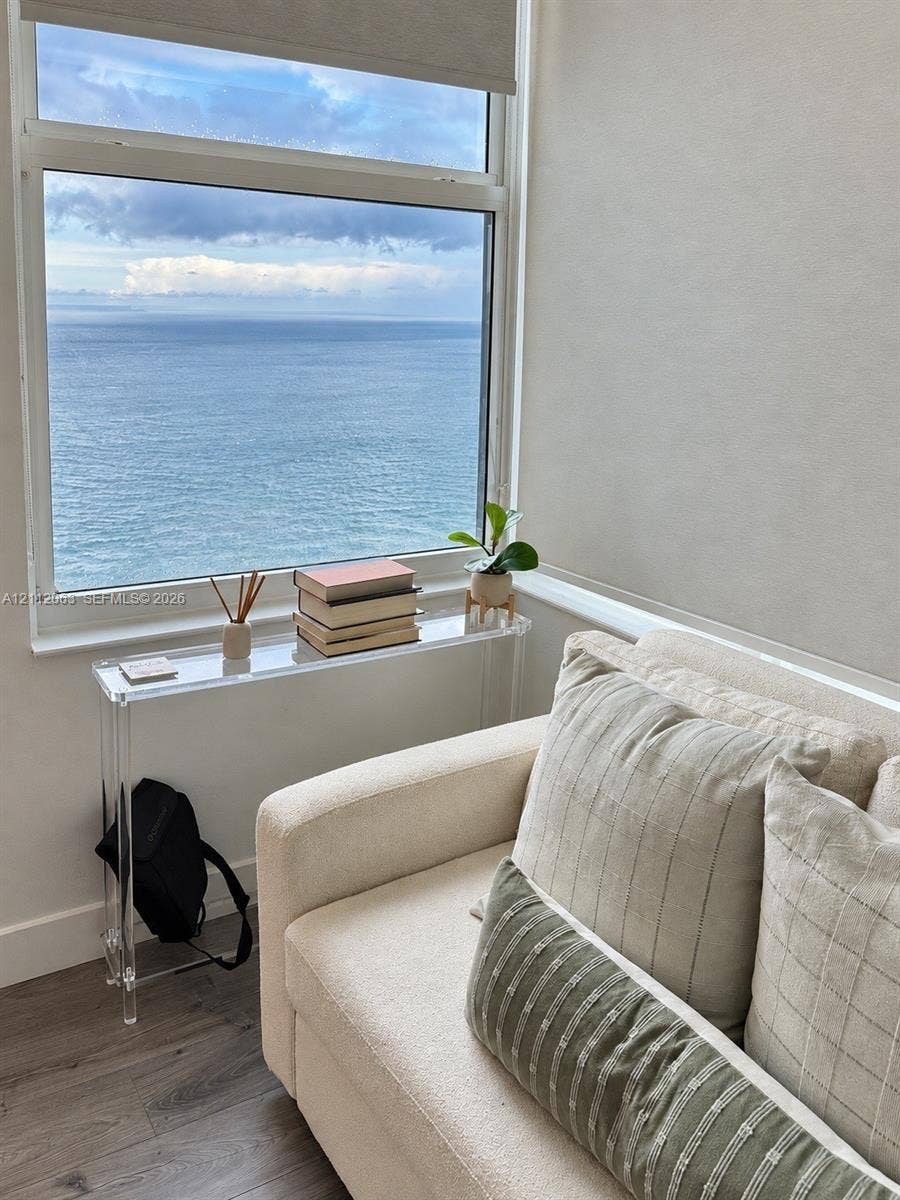 1360 S Ocean Boulevard, #2503, Pompano Beach, Pompano Beach, FL 33062 Large-format window featuring ocean scenery, wood-finish flooring, and roller shade hardware